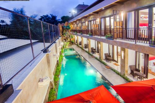 an overhead view of a swimming pool in a building at The Swaha Ubud Hotel in Sukawati