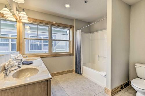 a bathroom with a sink and a toilet and a window at 7 Mi to Ski Main Street Dillon Condo in Dillon