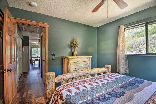 a bedroom with a bed and a window at Idyllic Cabin with Grill and Panoramic Mtn Views! in Estes Park
