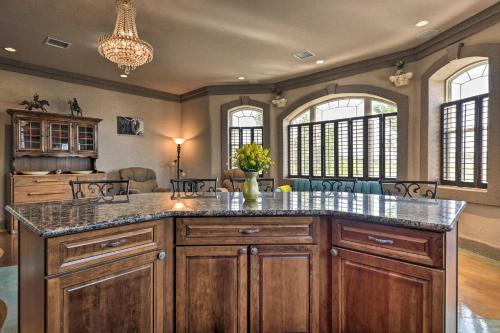 a kitchen with a large island in a room at Flawless Durango Home with Theater and Pool Table in Durango