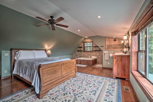 a bedroom with a bed and a ceiling fan at Yellow Mountain Blairsville Cabin with Scenic Deck in Hood