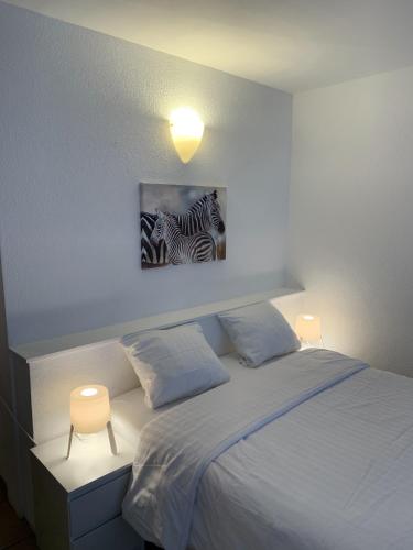 Postel nebo postele na pokoji v ubytování Residence Vue Chateau