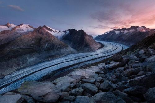a painting of a winding road in the mountains at Studio Apartment Alpine Lodge (36m2) - Bettmeralp - Ski in/out - South facing, overlooking the Alps in Bettmeralp