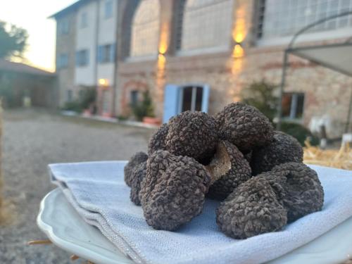 a pile of balls on a plate on a table at Tenuta San Giorgio in Serravalle Scrivia