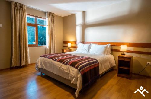 Una cama o camas en una habitación de Hotel Villarma