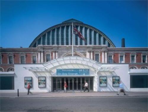 a building with people walking in front of it at Archery Close in Harrow Weald