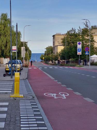a street with a bike lane on the side of the road at Apartament Nadmorski in Gdynia