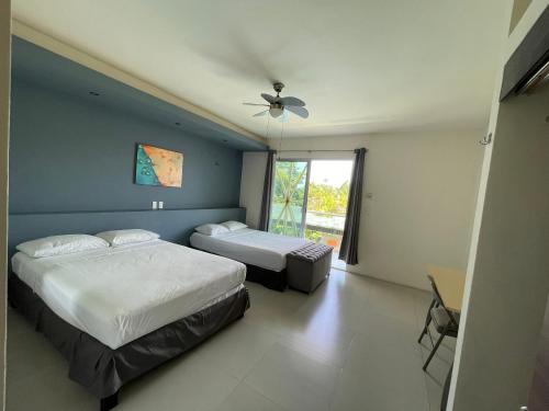 Ένα ή περισσότερα κρεβάτια σε δωμάτιο στο Hotel Villa Escondida Campeche
