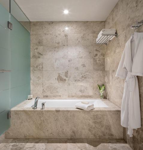 a bathroom with a bath tub and a shower at Ocean Casino Resort in Atlantic City