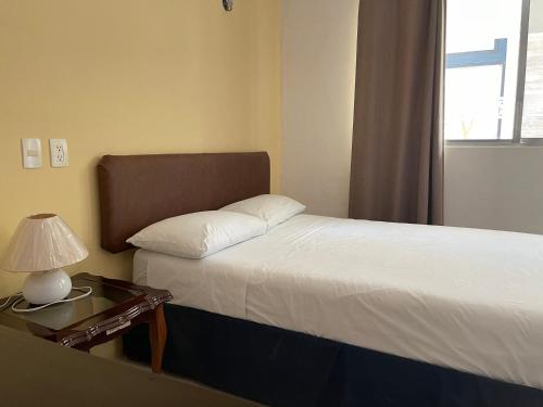 Ένα ή περισσότερα κρεβάτια σε δωμάτιο στο Hotel Villa Escondida Campeche