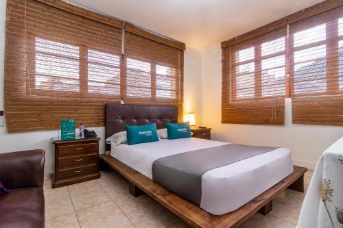 Un pat sau paturi într-o cameră la Ayenda Eloina