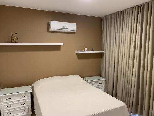 Ένα ή περισσότερα κρεβάτια σε δωμάτιο στο House Relax Parque das Águas Quentes