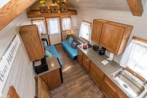 an aerial view of a kitchen and living room in a tiny house at Tiny House Leadville Colorado in Leadville