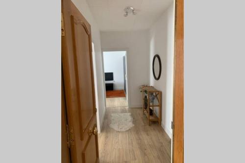a hallway with an open door to a room at Para un descanso total in Sant Jaume dels Domenys
