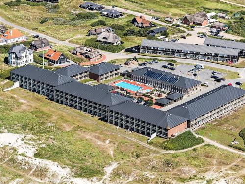an aerial view of a building with a pool at 6 person holiday home on a holiday park in Fanø in Fanø