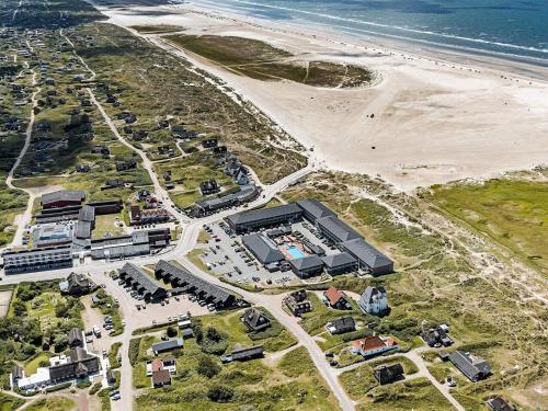 an aerial view of a building next to the beach at 4 person holiday home on a holiday park in Fan in Fanø