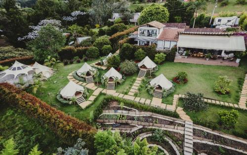 
a house that has a bunch of plants in it at TEVA Glamping & Retreat in Rionegro
