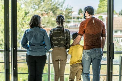 a group of people looking out of a window at Hotel & Suites en Cuenca, Venue Batán in Cuenca