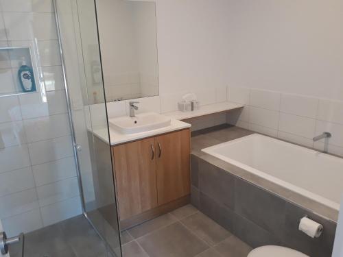 a bathroom with a sink and a toilet and a shower at Sparkling Fresh & Egyptian Bedding & Towels Provided in Torquay