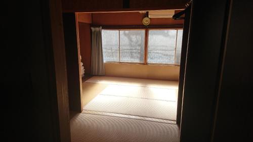 Postel nebo postele na pokoji v ubytování Guesthouse Kumano