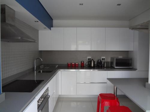 Η κουζίνα ή μικρή κουζίνα στο Designer Studio Camps Bay