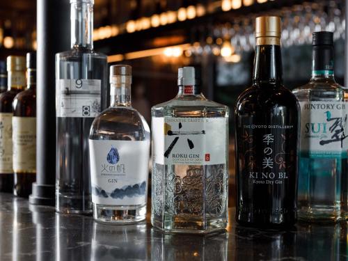 a group of bottles of alcohol sitting on a table at Susukino Granbell Hotel in Sapporo