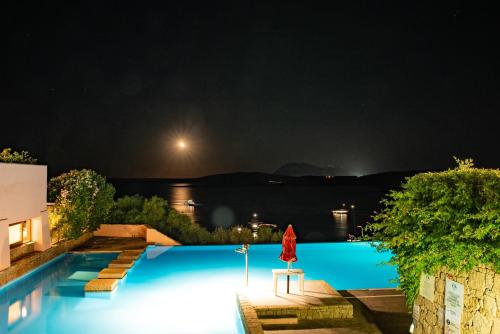 a view of a swimming pool at night at Casa Valery Wonderful Sea View in Porto Rotondo