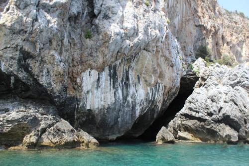 a cave in the side of a rocky cliff at IsolaDino b&b sweet home in Praia a Mare