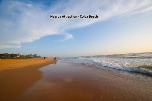 a beach with the words mercy activationahoaho beach at Meadow View Resort in Majorda