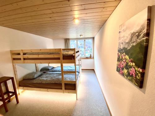 Postel nebo postele na pokoji v ubytování Appartement Aareschlucht- Grandiose Aussicht für 2-6 pers.