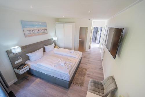 a bedroom with a bed with a starfish on it at Marina Martinshafen in Sassnitz