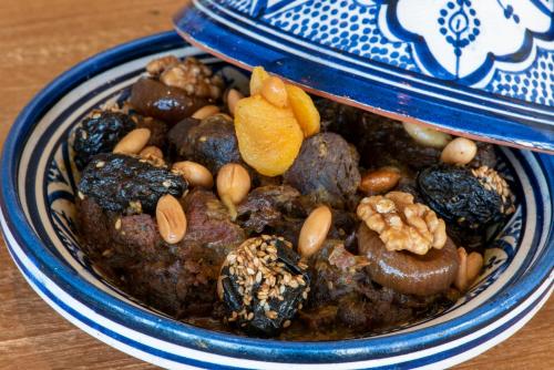 a blue and white bowl of food with nuts at Hyatt Regency Taghazout in Taghazout