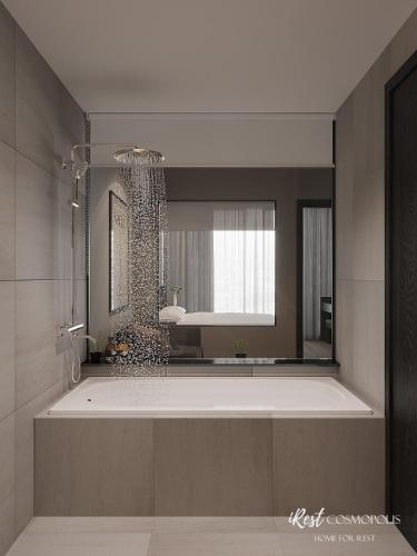 a bathroom with a large tub and a mirror at iRest COSMOPOLIS Vinh Yen in Yen