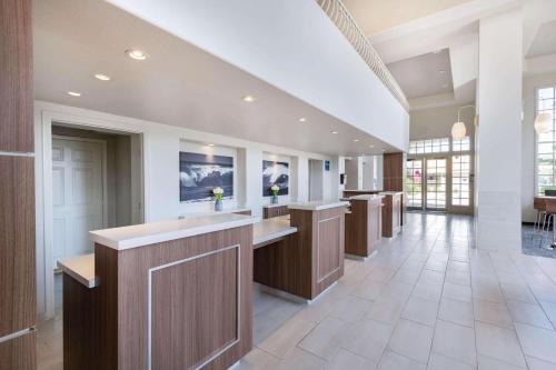 a large kitchen with a large island in a house at Wyndham Garden San Diego in San Diego