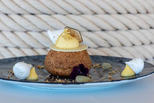 a plate with a dessert with cheese on it at Hyatt Regency Taghazout in Taghazout