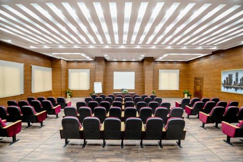 an empty conference room with chairs in it at Tolip Gardens Hotel in Cairo