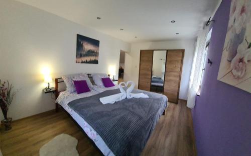 Postel nebo postele na pokoji v ubytování Apartman Patricia