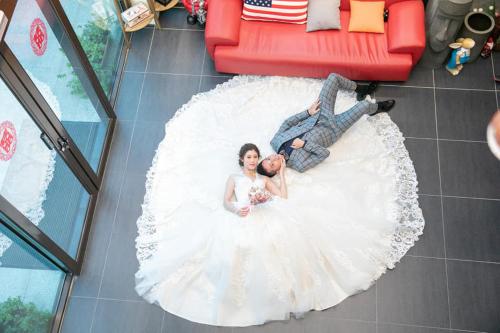 a bride and groom in a wedding dress on the floor at GOD’S Queen Esther in Nangan