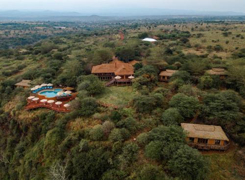an aerial view of a house with a swimming pool at Escarpment Luxury Lodge Manyara in Mto wa Mbu