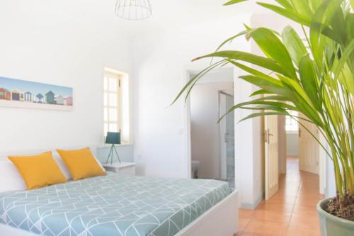 Ένα ή περισσότερα κρεβάτια σε δωμάτιο στο OLA Guesthouse