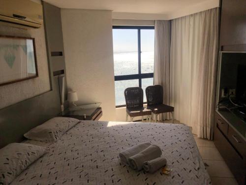 En eller flere senger på et rom på Iate Plaza Beiramar Fortaleza app1006