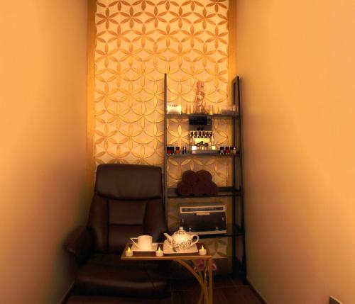a corner of a room with a chair and a table at Hyatt Place Dubai Jumeirah in Dubai