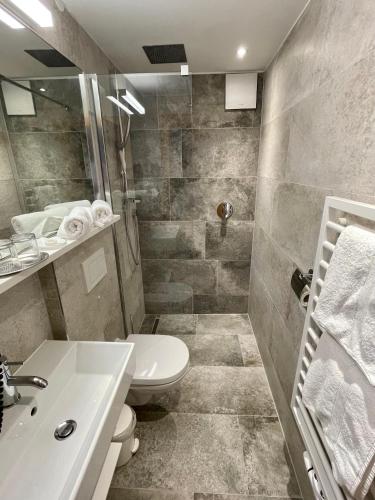 a bathroom with a toilet and a sink at Haus Steffeler in Sankt Anton am Arlberg