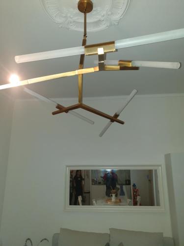 a chandelier hanging from a ceiling in a room at Room I - Atalaia - Bairro Alto in Lisbon