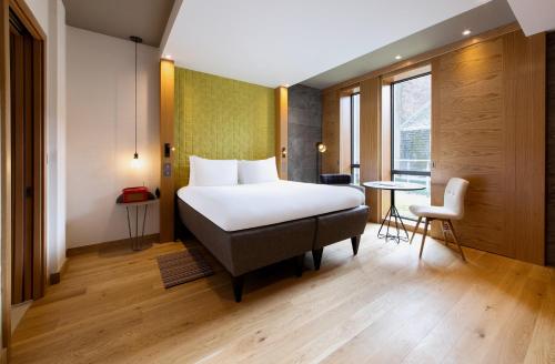 a hotel room with a bed and a table at Market Street hotel in Edinburgh