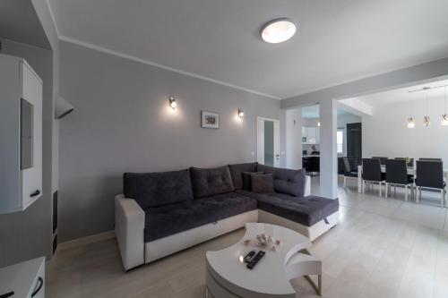 a living room with a couch and a table at Villa Ban in Trogir