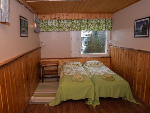 Postel nebo postele na pokoji v ubytování Hotel Korpikartano