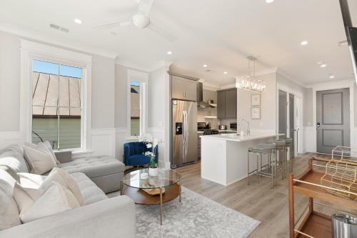 a living room and kitchen with a couch and a table at The Jasmine Suite at 124 Spring in Charleston