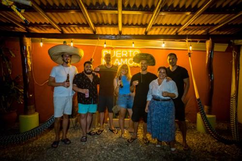 a group of people standing in a room at Casa Losodeli & Coworking- Adults Only in Puerto Escondido