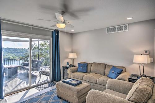 a living room with a couch and chairs and a balcony at Table Rock Lake Hideaway with Deck Bring Your Boat! in Golden